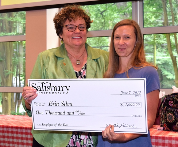 SU President Janet Dudley-Eshbach, left, presented 2017 Employee of the Year Erin Silva with a commemorative check.